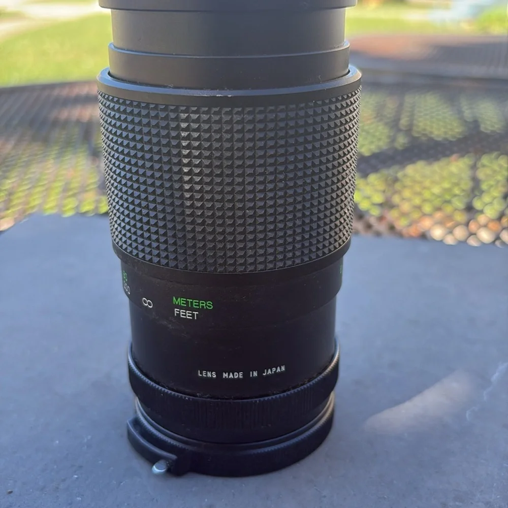 The image shows a Vivitar 300mm 1:5.6 lens. Additional information: